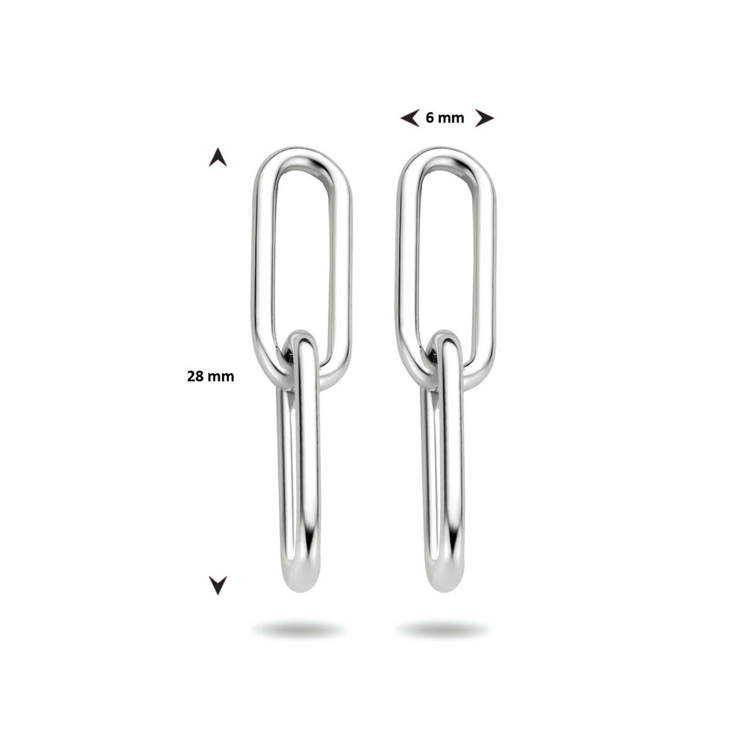De afbeelding toont de Van der Kooij Collectie oorhangers paperclip zilver gerhodineerd: twee zilveren ovale schakels, elk 28 mm lang en 6 mm breed, verticaal afgebeeld met gelabelde pijlen die de hoogte en breedte aangeven.