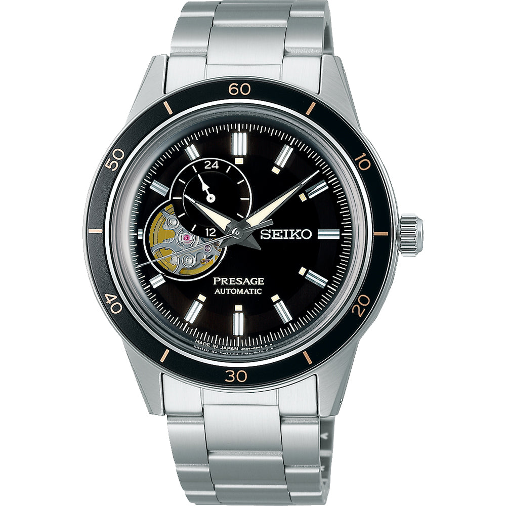Heren horloge van staal met zwarte wijzerplaat, automatische beweging en opengewerkte achterkant.