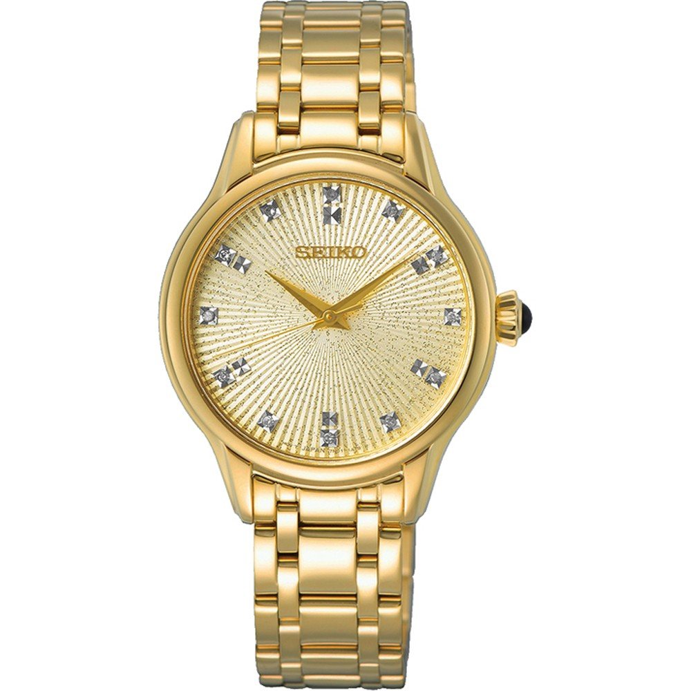 Gouden dames horloge met een stralende wijzerplaat en glinsterende steentjes als index.