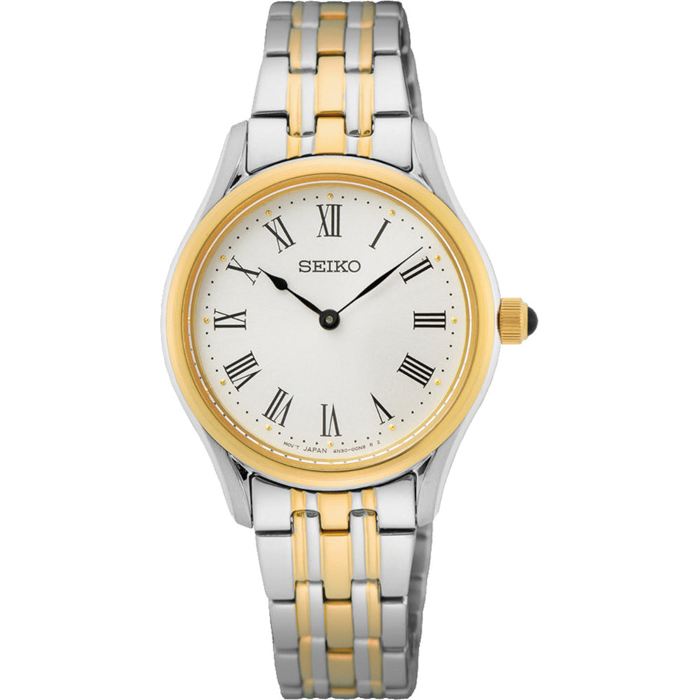 Zilveren dames horloge met gouden accenten, ronde wijzerplaat en Romeinse cijfers.