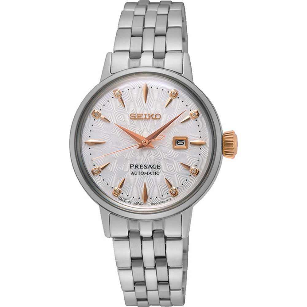 Het Seiko Presage dameshorloge SRE009J1, met een Hardlex mineraalglas kast, heeft een automatisch uurwerk. De zilveren metalen schakelband past bij de witte wijzerplaat met goudkleurige markeringen en wijzers. Een gestructureerde achtergrond en datumvenster op 3 uur maken de tijdloze elegantie compleet.