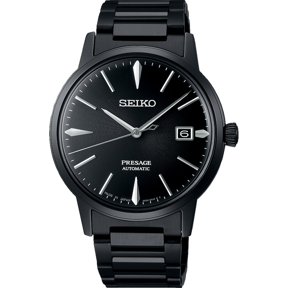 Zwart heren horloge van Seiko met automatische beweging, zwarte wijzerplaat en stalen schakelband.
