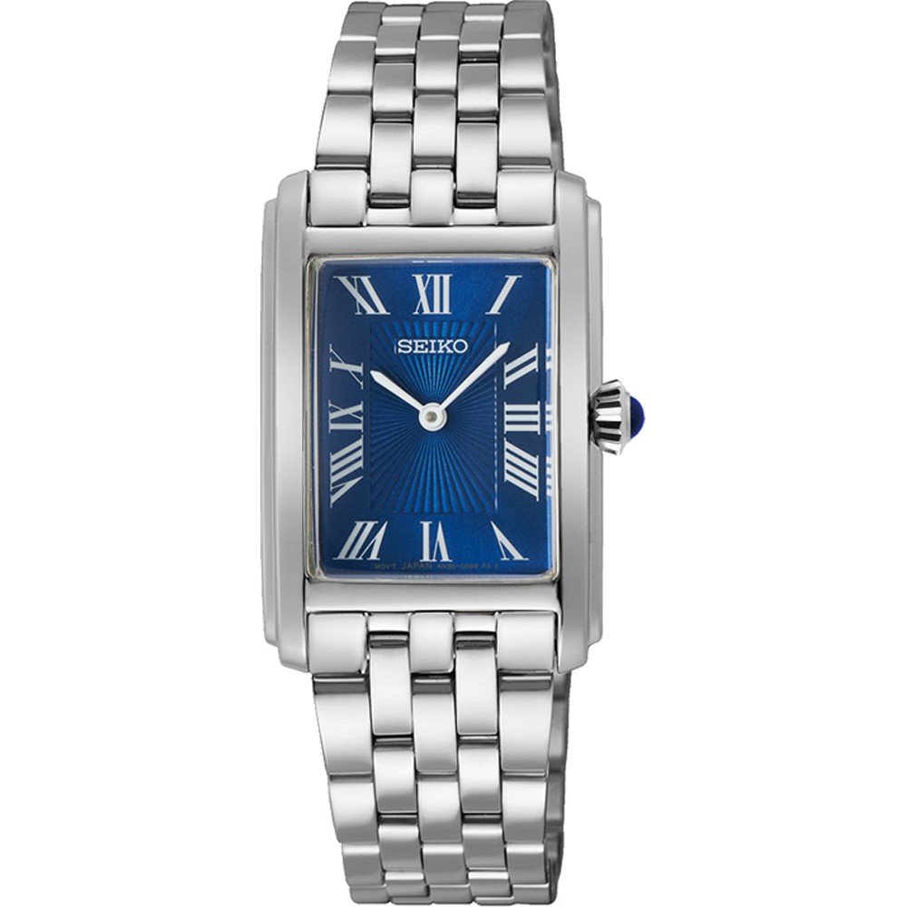 Zilveren dames horloge met rechthoekige kast, blauwe wijzerplaat en Romeinse cijfers.