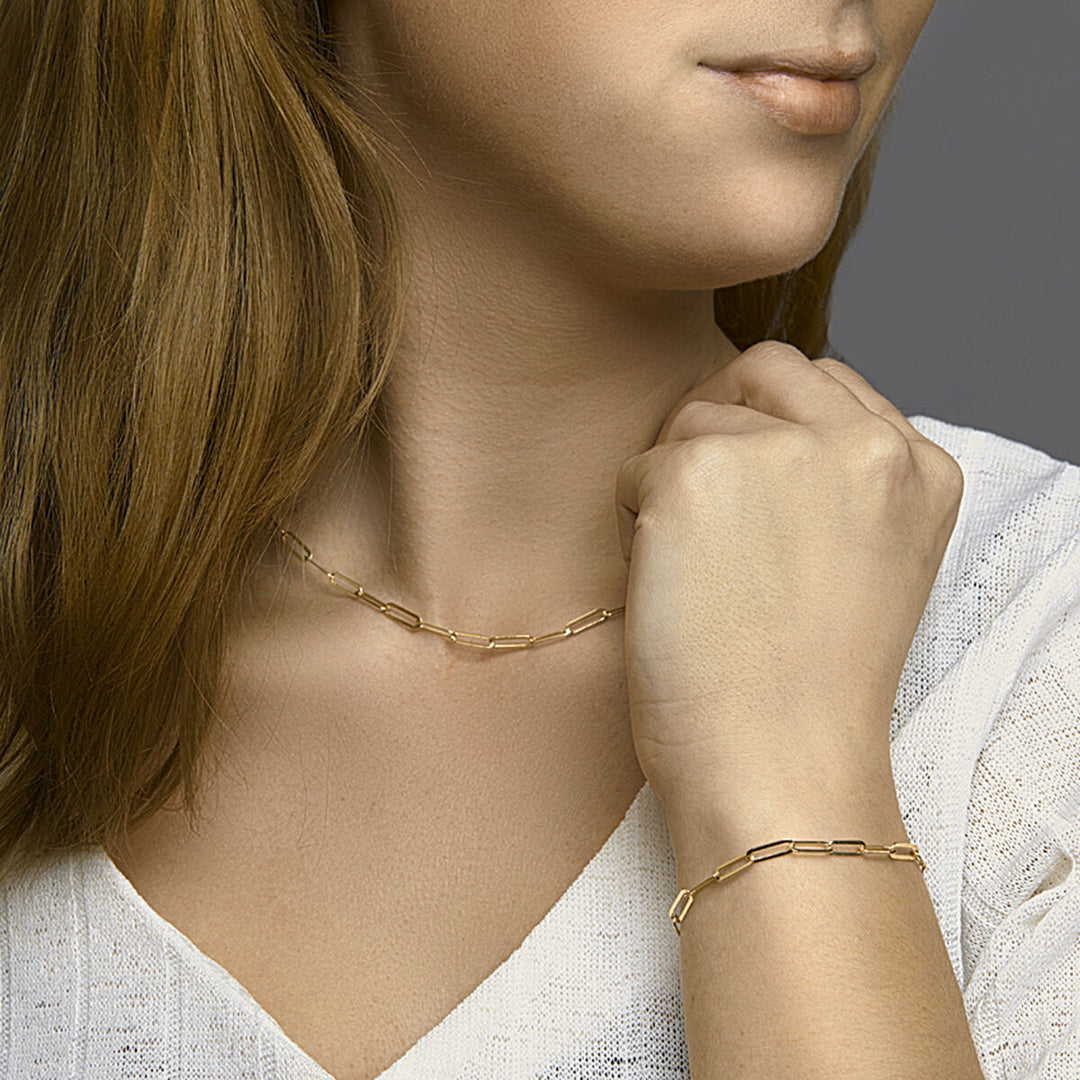 Goudkleurige paperclip armband op zilver