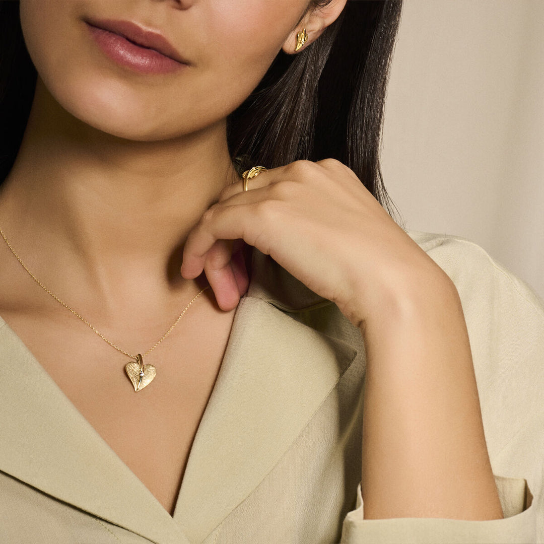 oorknoppen hart gescratcht diamant 0.04ct (2x 0.02ct) h si 14K geelgoud