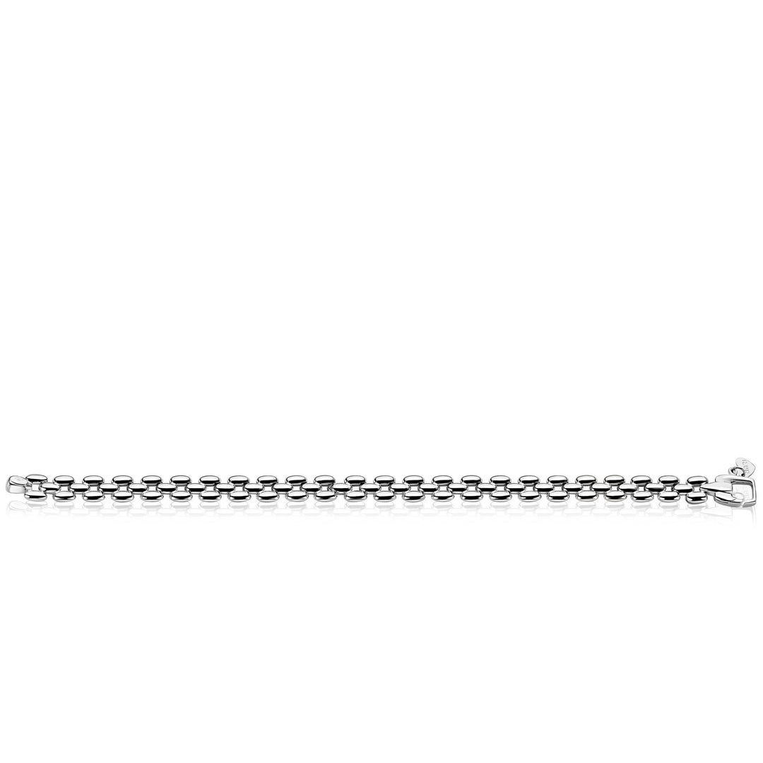 De Zinzi schakelarmband zilver ZIA2764 heeft een klassiek ontwerp van een doosketting en een karabijnsluiting, die subtiele elegantie uitstralen. Weergegeven op een witte achtergrond, is dit Zinzi stuk ideaal voor fans van de tijdloze Rolex-stijl schakel-armband look.