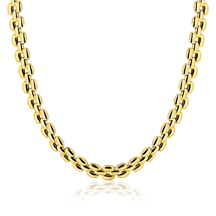 Een close-up van de Zinzi Ketting Gold Plated ZIC2764G van Zinzi, met vergulde ovale schakels in een symmetrisch patroon, wordt getoond tegen een witte achtergrond met de focus op het onderste deel van de ketting.