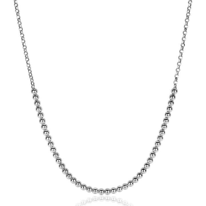 De Zinzi Ketting Zilver ZIC2640 van Zinzi heeft kleine, glanzende zilveren kraaltjes die dicht op elkaar zitten langs de onderste helft van een delicate jasseron ketting, afgebeeld op een witte achtergrond.
