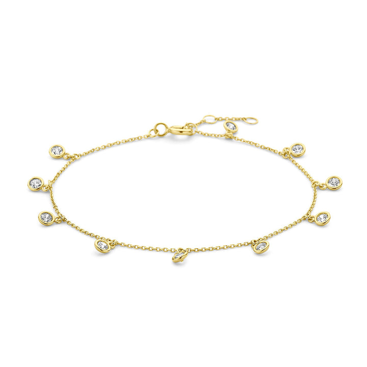 De Gouden armband dames zirkonia 14K uit de Van der Kooij Collectie heeft een minimalistisch ontwerp met bungelende ronde zirkonia in bezel zettingen en verstelbare sluiting. Elegant en verfijnd, ideaal voor elke gelegenheid.