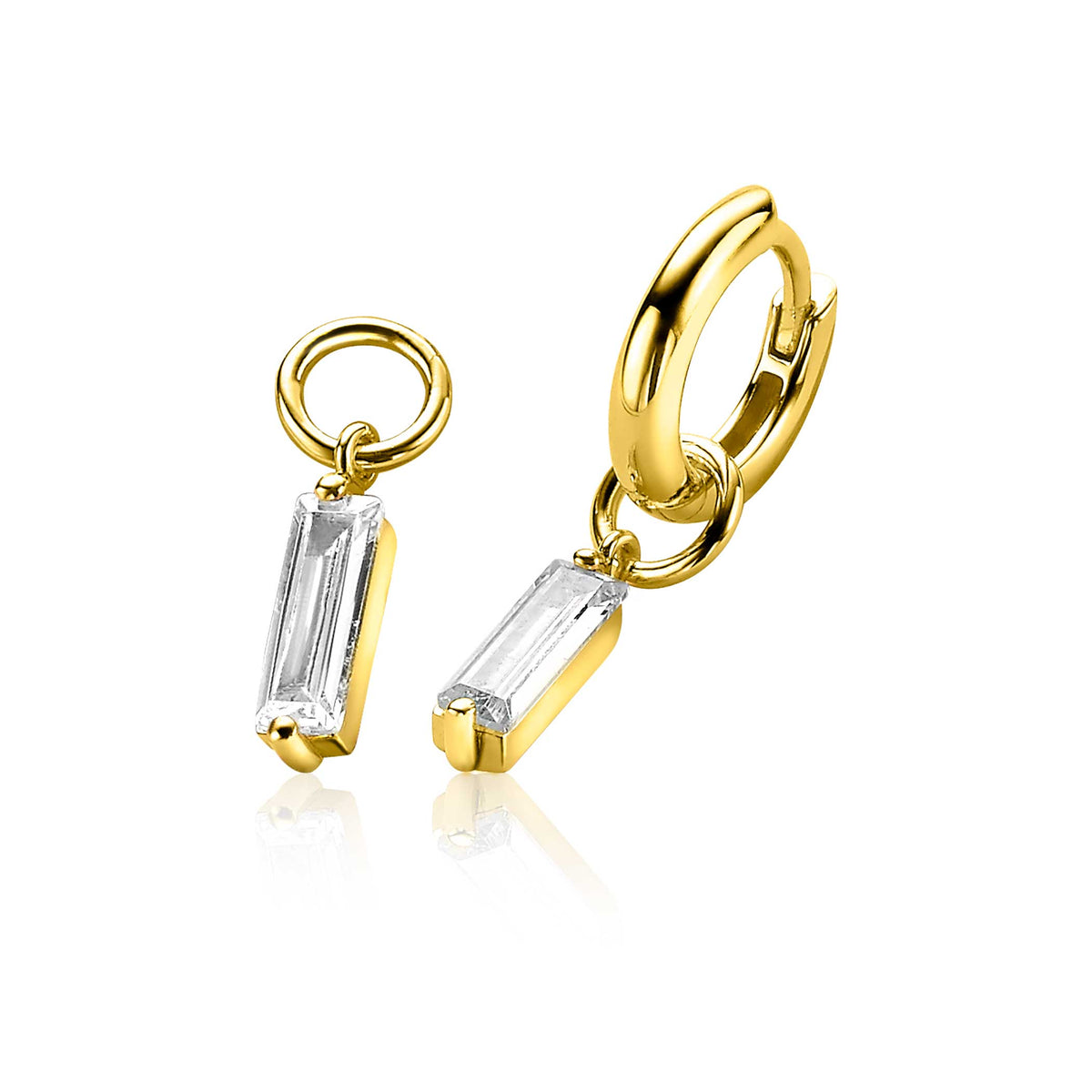 Gouden oorbellen met een hangende, rechthoekige, transparante steen.