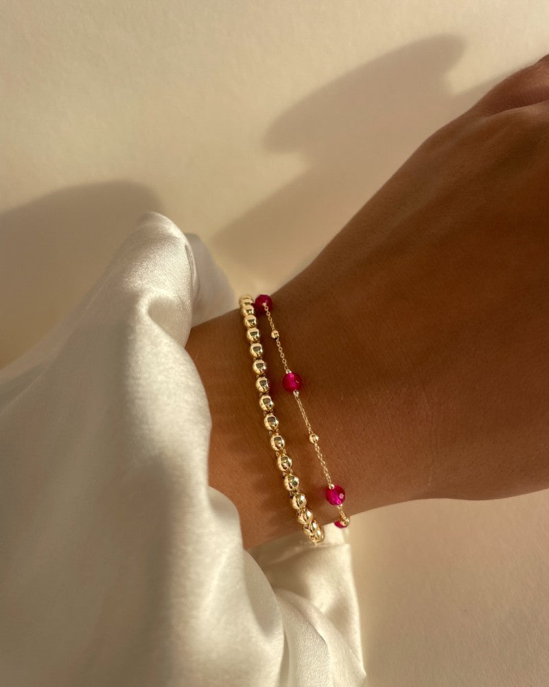 Soepele Geelgouden Armband met Gouden Bolletjes – Elegantie in Simpliciteit