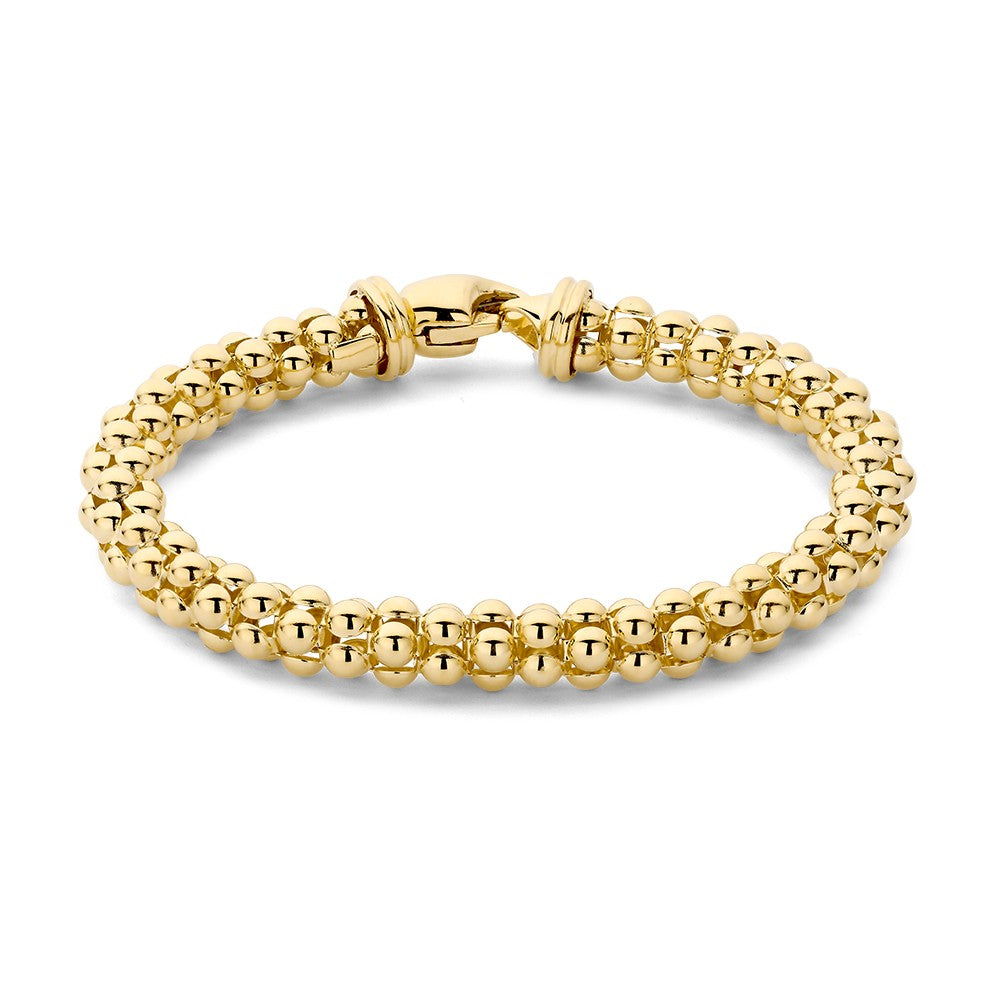 Geelgouden armband met bolvormige schakels en een karabijnsluiting.