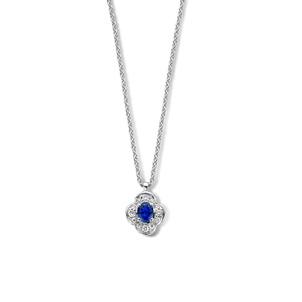 Witgouden collier met bloemhanger, centraal een blauwe saffier omringd door diamanten.