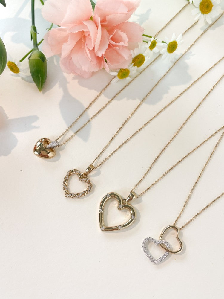 Gouden hanger van twee verbonden harten – 14 karaat geel/witgoud – Zirkonia