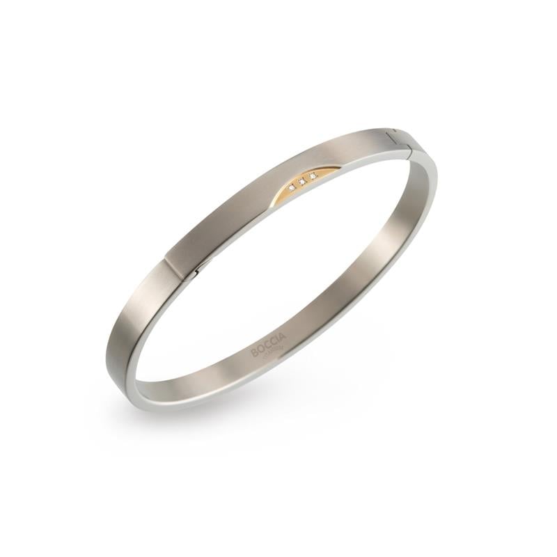 Bicolor titanium armband met een glanzende afwerking en drie kleine diamantjes.