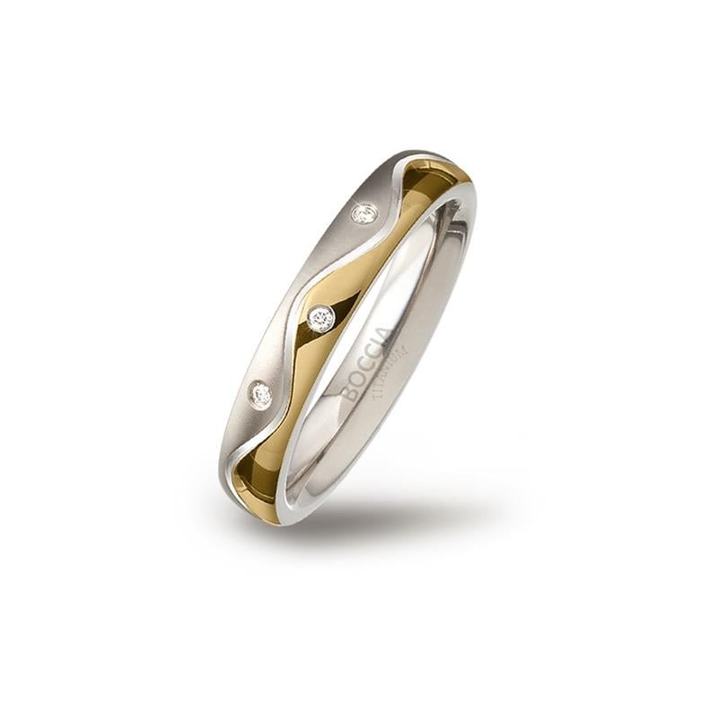 Bicolor titanium ring met een golvende vorm en drie kleine diamanten.