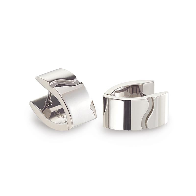 Titanium oorringen met een moderne, golvende vorm en een glanzende afwerking.