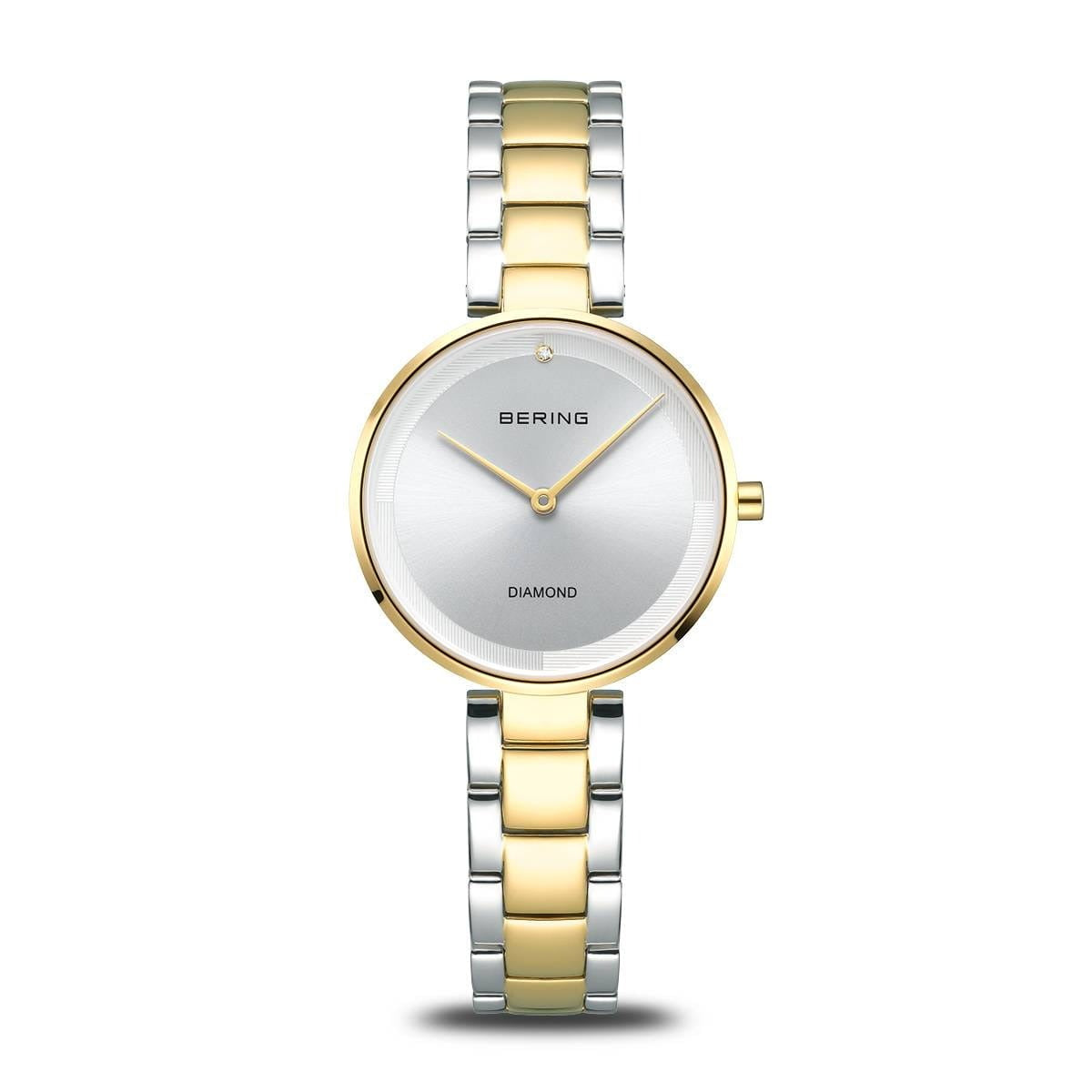 Gouden en zilveren horloge met een ronde wijzerplaat en een glanzende afwerking.