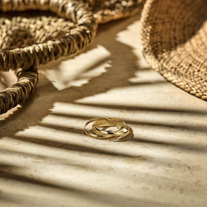 9k Geelgouden damesring met drie in elkaar verweven banden