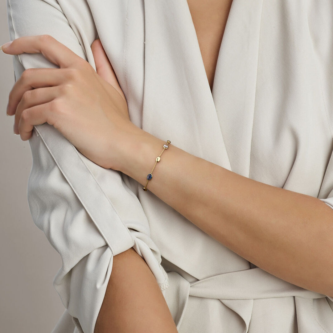 14k Geelgouden armband met sky blue en London blue topaas