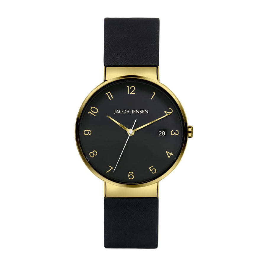 Gouden horloge met zwarte wijzerplaat en zwarte rubberen band, eenvoudige cijfers en datumaanduiding.