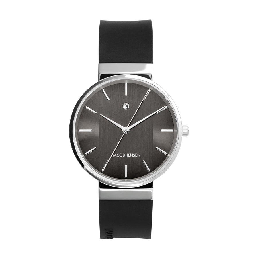 Zwart rubberen horloge met een ronde, zilveren kast en een grijze wijzerplaat met streepjesindex.
