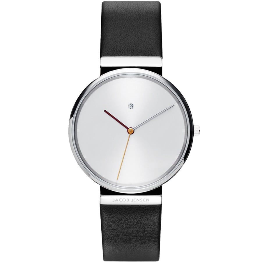 Zilveren horloge met een minimalistische wijzerplaat, zwarte leren band en opvallende oranje secondewijzer.