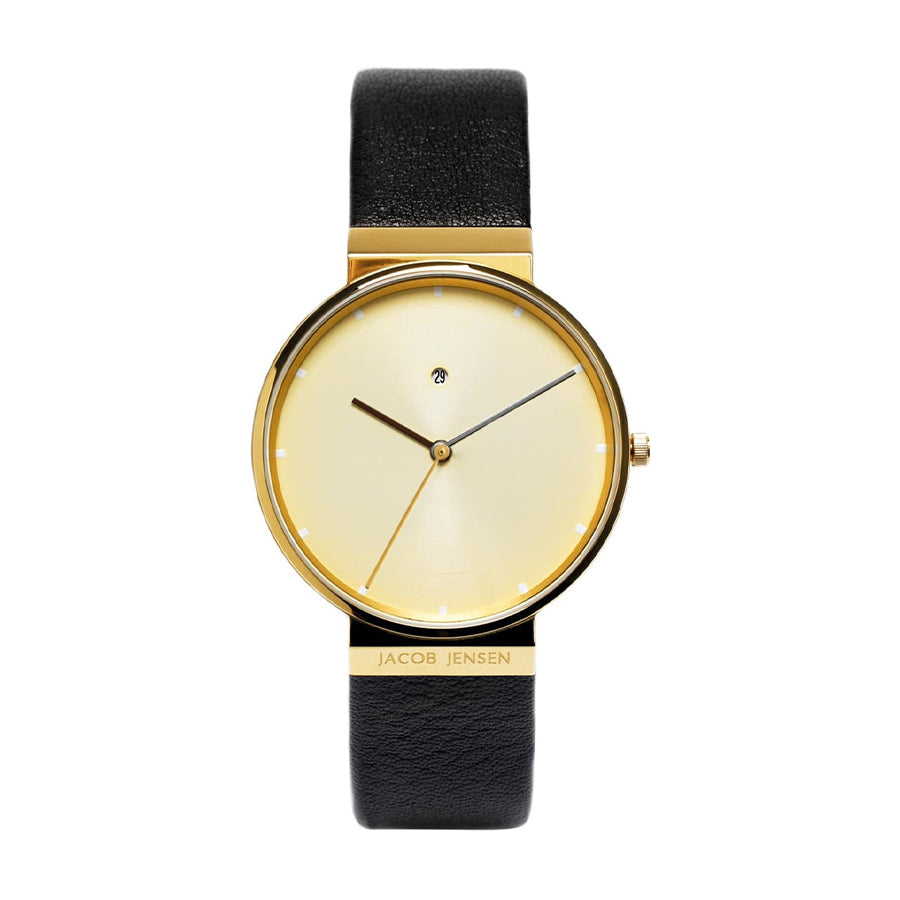 Gouden horloge met een gele wijzerplaat en zwarte leren band.