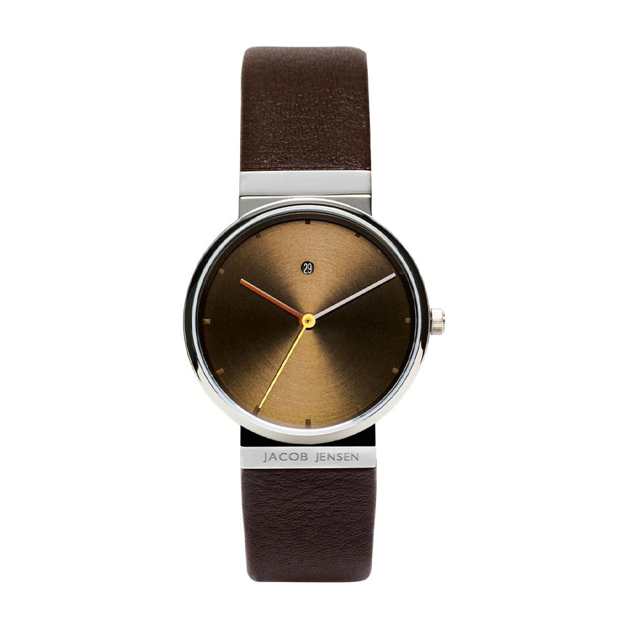 Bruin leren horloge met een ronde, bronzen wijzerplaat en opvallende gele en oranje wijzers.