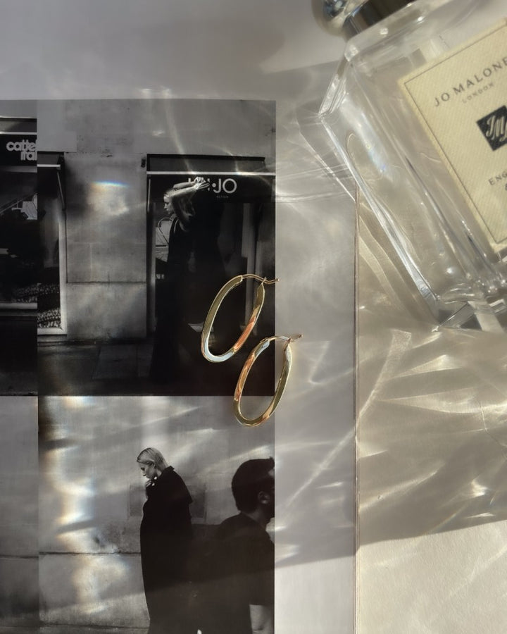 Geelgouden Oorringen met Speelse Twist – 14 Karaat Goud