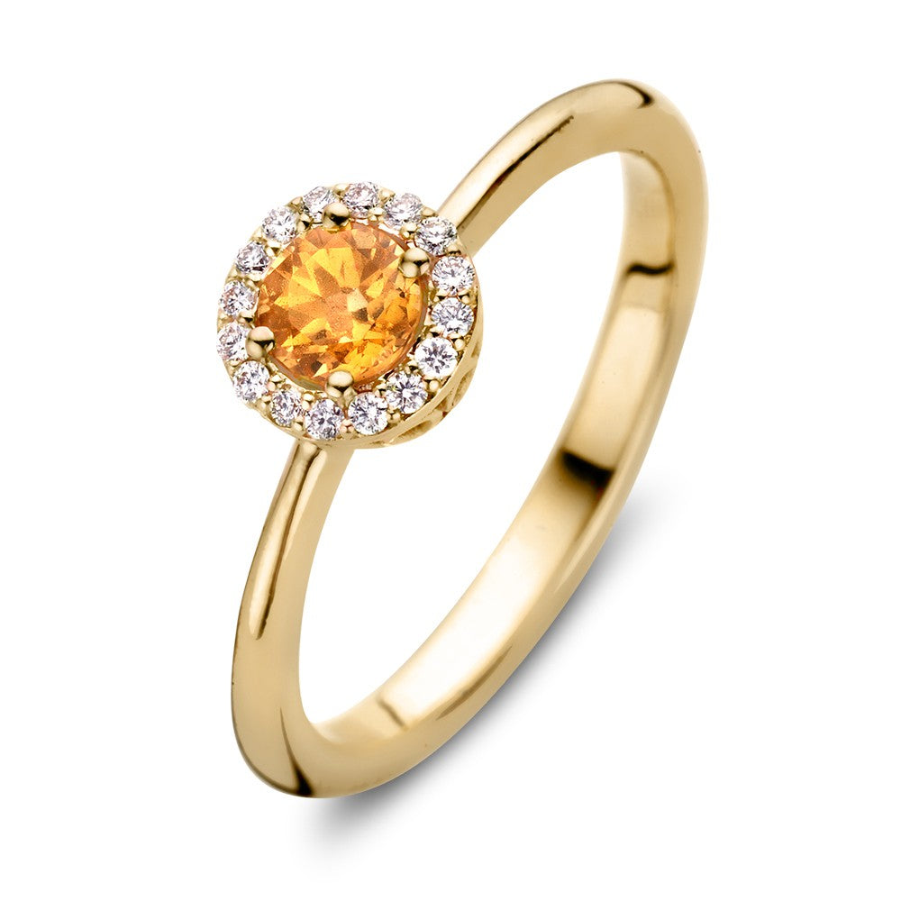 Luxe 18kt geelgouden entourage ring met een ronde oranje saffier omringd door kleine diamanten.
