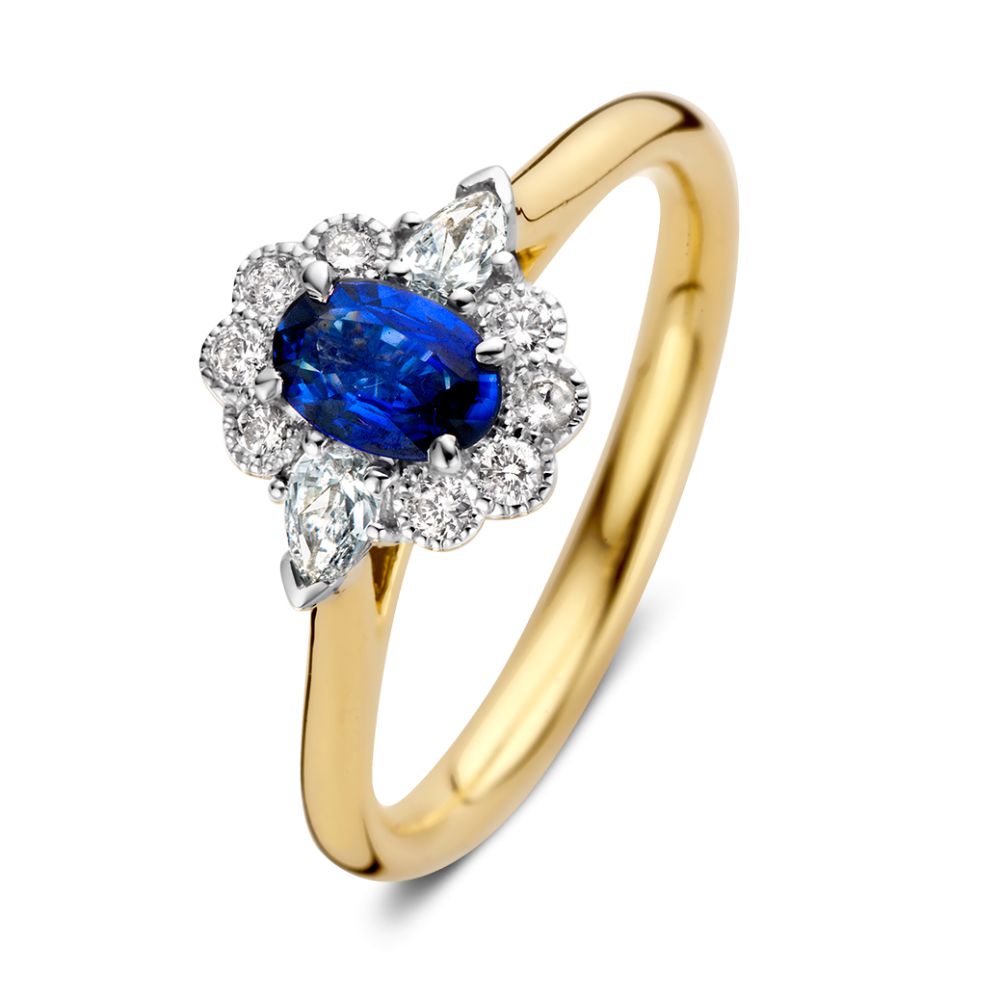Gouden damesring met ovale blauwe saffier omringd door een halo van diamanten.
