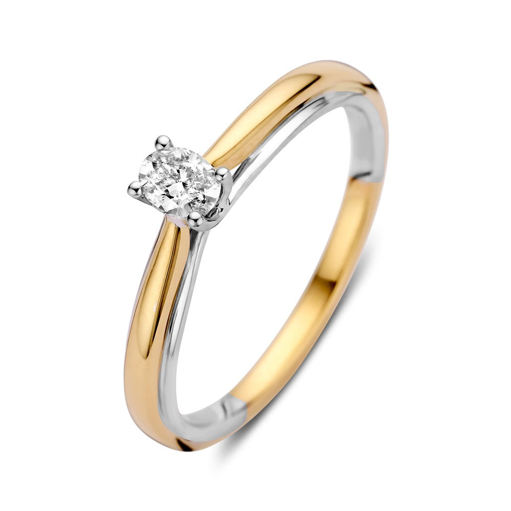 De Excellent Jewelry 14k bicolor gouden solitaire ring heeft een ovale diamant van 0,19ct gezet in een prong zetting, waarvan de ene helft in geelgoud en de andere helft in witgoud.