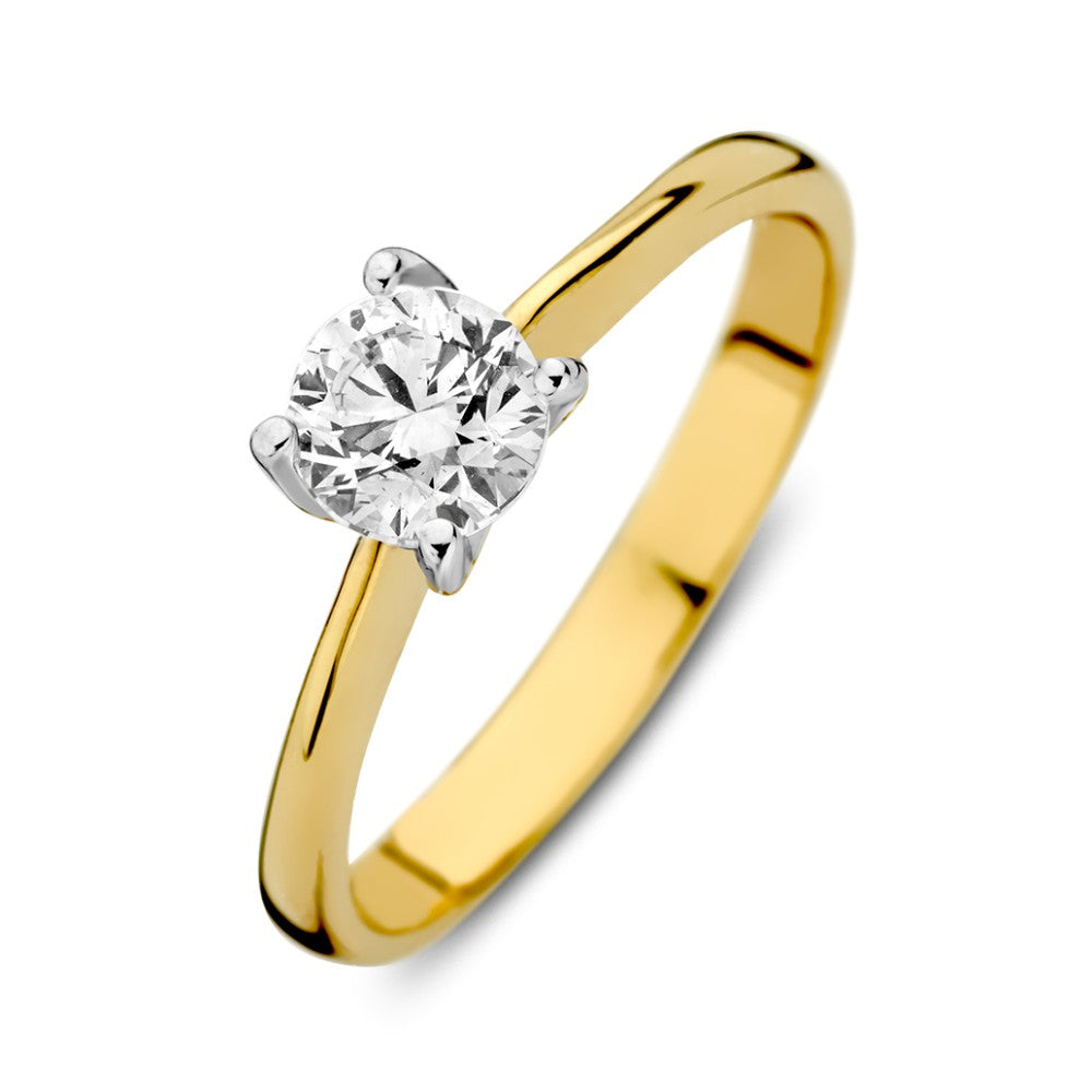 De Bicolor Wit- en Geelgouden Solitair Ring met Zirkonia - 14-karaat van Excellent Jewelry voor dames heeft een ronde witte zirkonia in een vierpoots witgouden zetting en wordt gepresenteerd tegen een witte achtergrond.