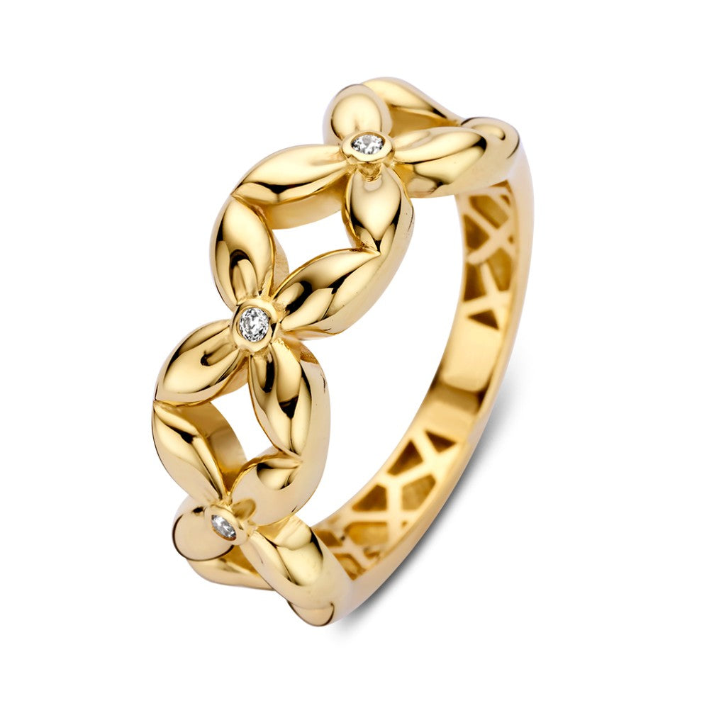 Brede geelgouden ring met bloemenontwerp en zirkonia hartjes, glanzende afwerking.
