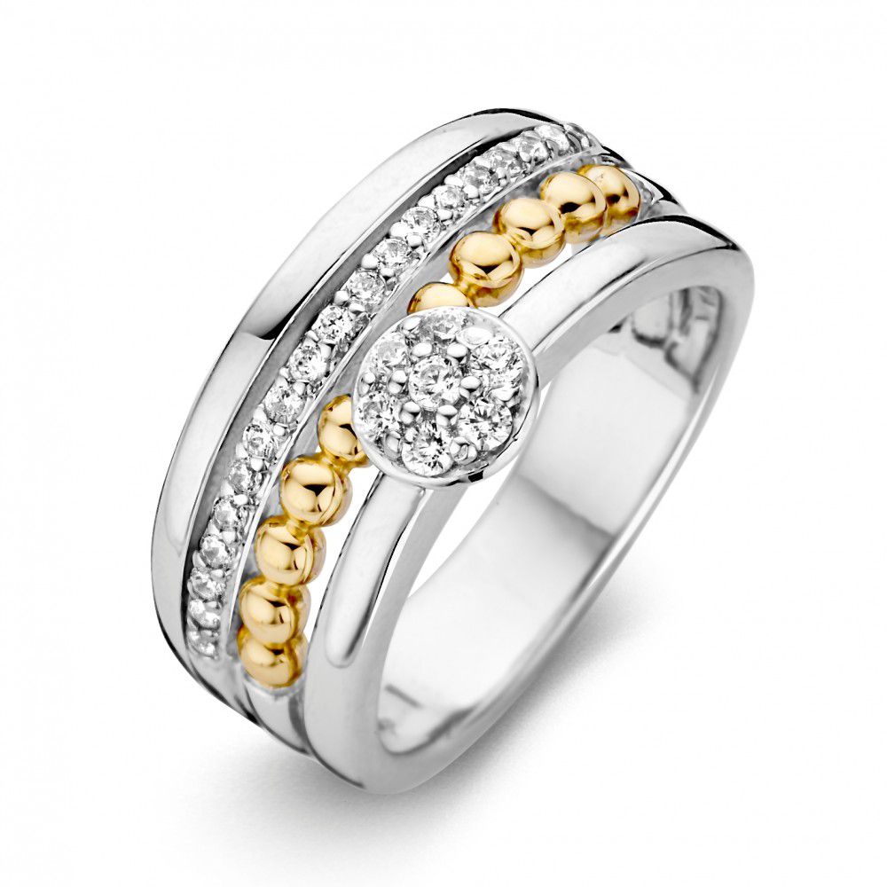 Zilveren ring met gouden bollen en zirkonia-steentjes in een moderne, gestapelde stijl.