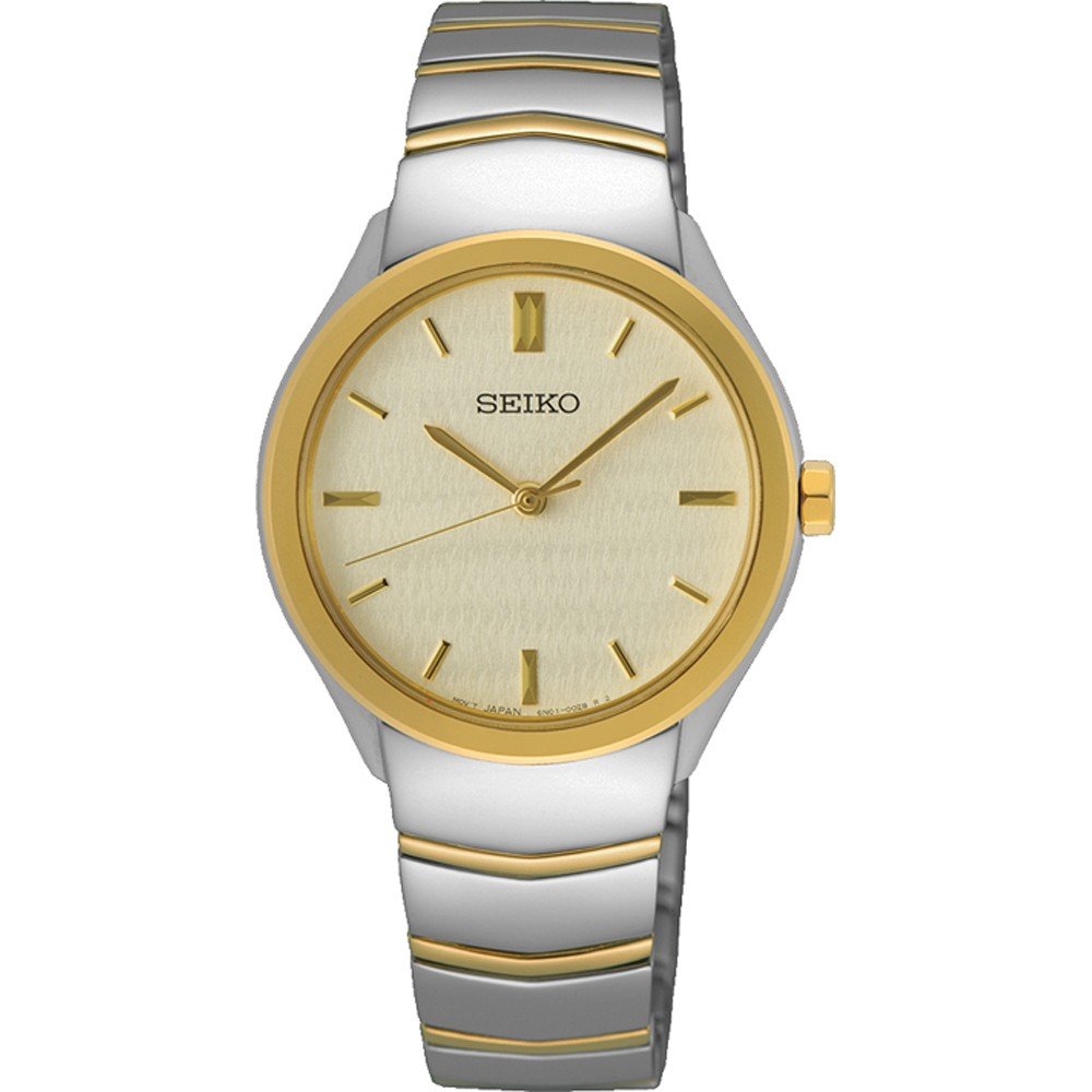 Dames horloge van staal met een gouden bezel en een lichtgele wijzerplaat, voorzien van een schakelband.