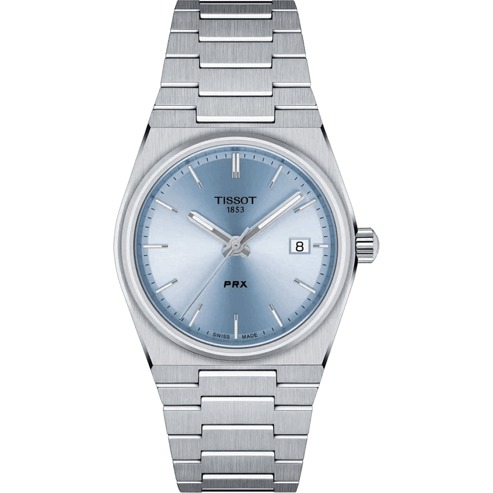Zilveren Tissot PRX horloge met een blauwe wijzerplaat en een datumaanduiding, voorzien van een metalen schakelband.
