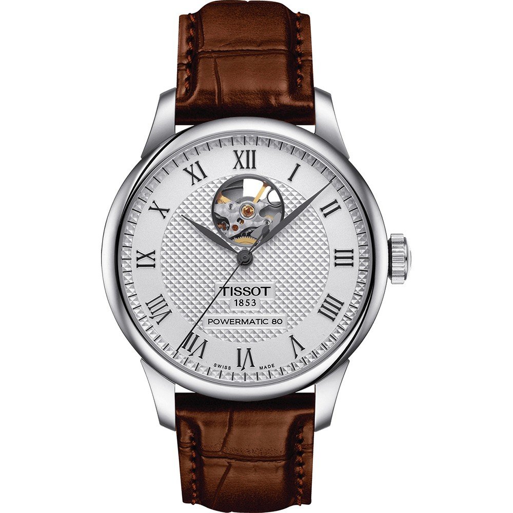Zilveren horloge met open hart, witte wijzerplaat, Romeinse cijfers en bruine leren band.