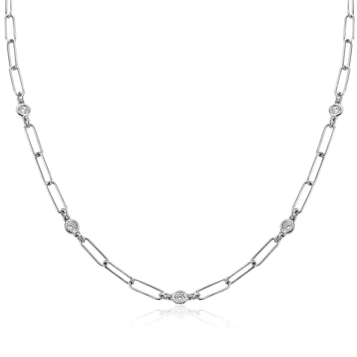 Zilveren ketting met schakels en ronde, fonkelende steentjes.