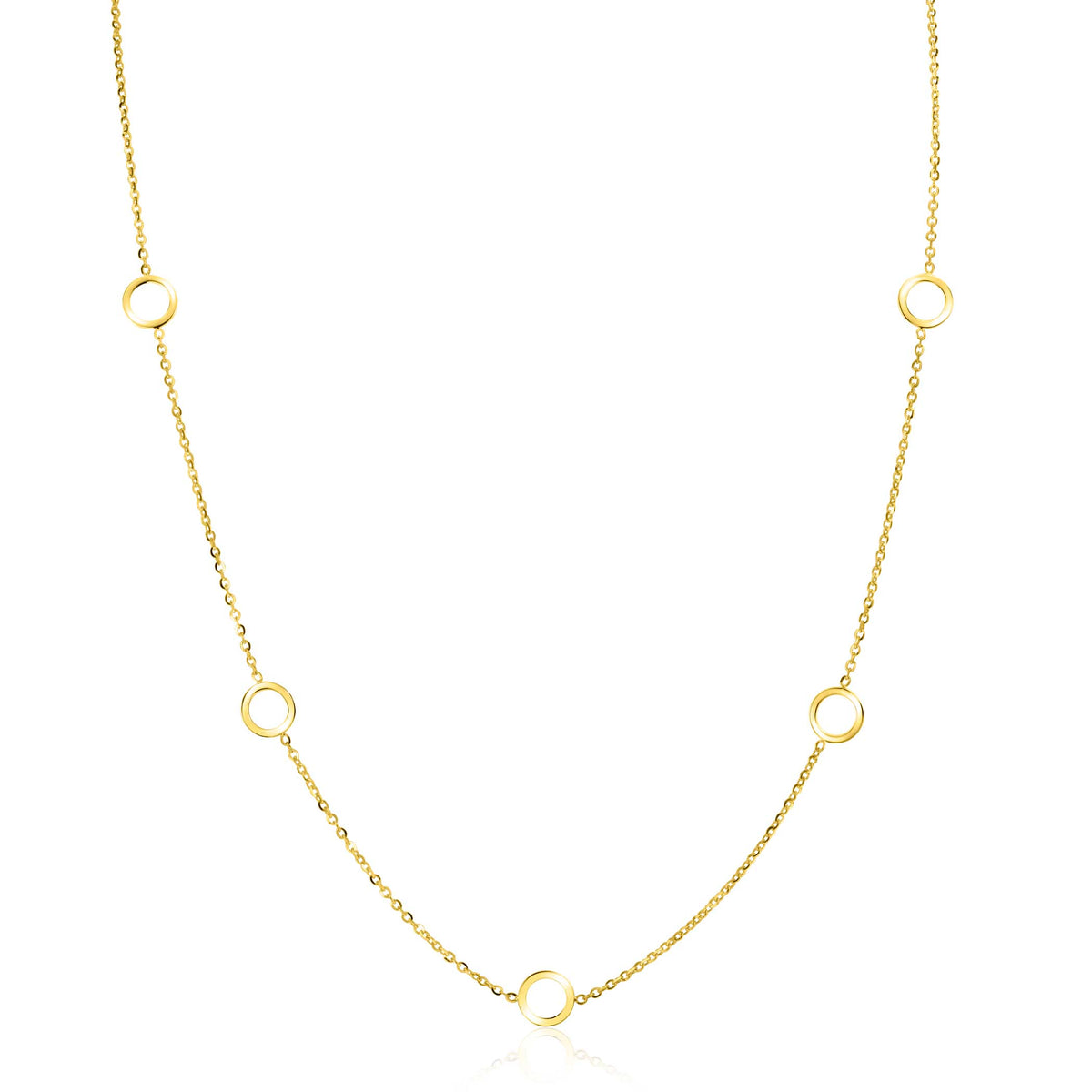 De Zinzi Ketting Goud Zgc445 van Zinzi heeft een delicate ketting met vijf gelijkmatig verdeelde kleine ringen, die de tijdloze jasseron schakels-stijl weerspiegelen. Het minimalistische en elegante ontwerp komt prachtig tot zijn recht tegen een effen witte achtergrond.