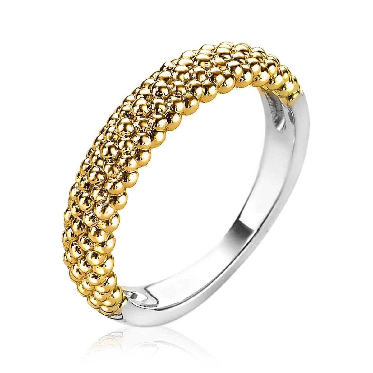 Gouden ring met bolletjesstructuur en een glanzende zilveren binnenkant.