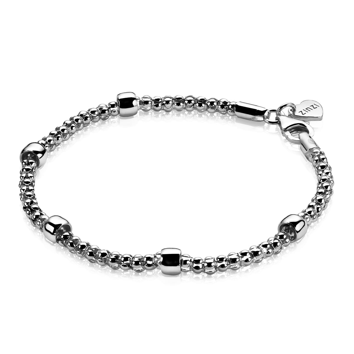 Zilveren armband met een schakelstructuur en ronde, glanzende elementen.