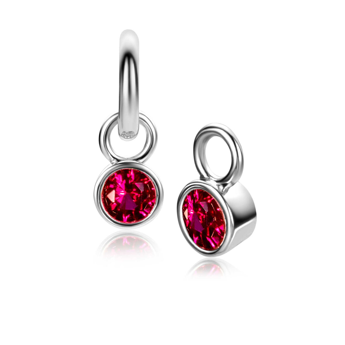 Zilveren oorbellen met ronde, fuchsia kleurige steentjes.