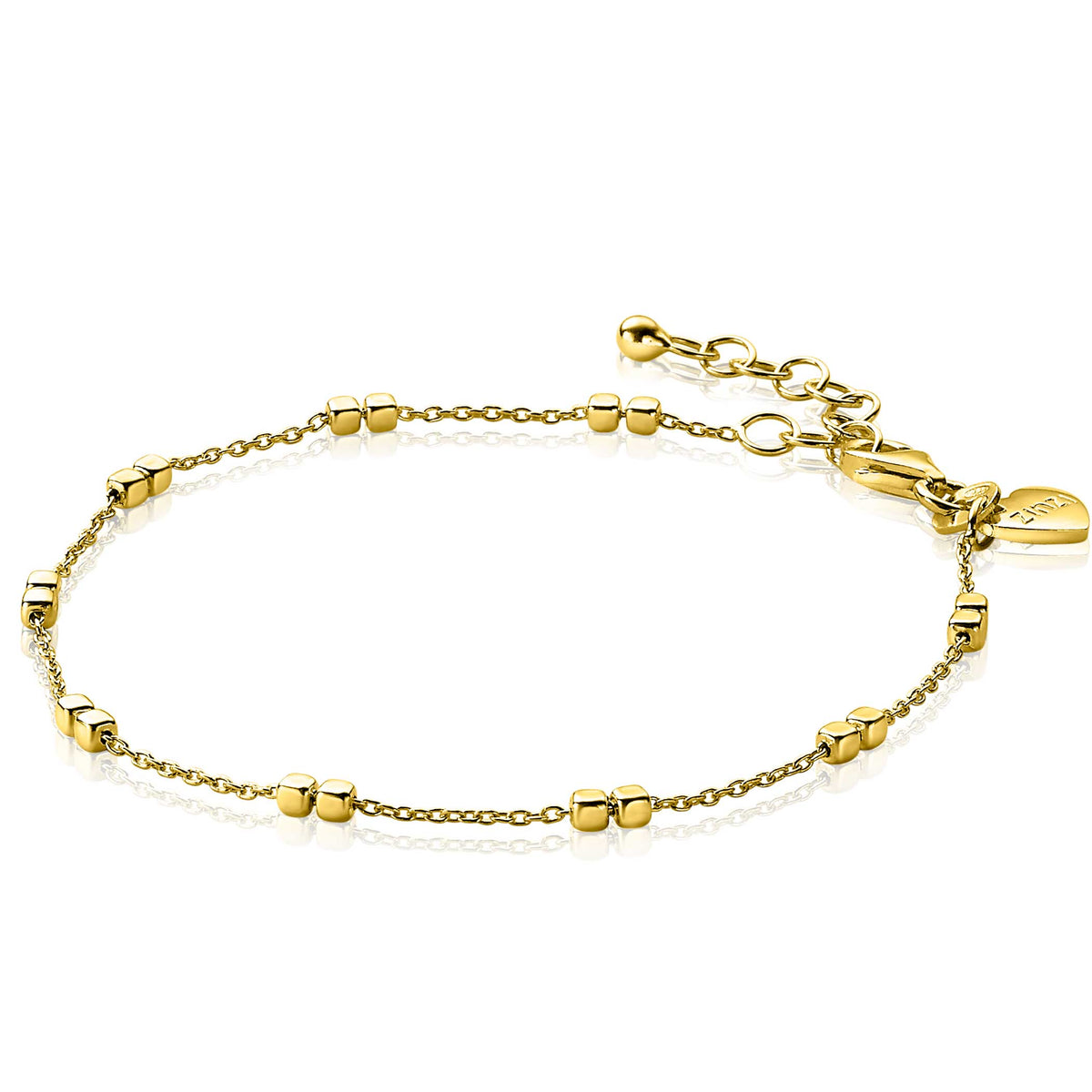 Gouden armband met bolletjes en een verlengketting, afgewerkt met een hangertje.