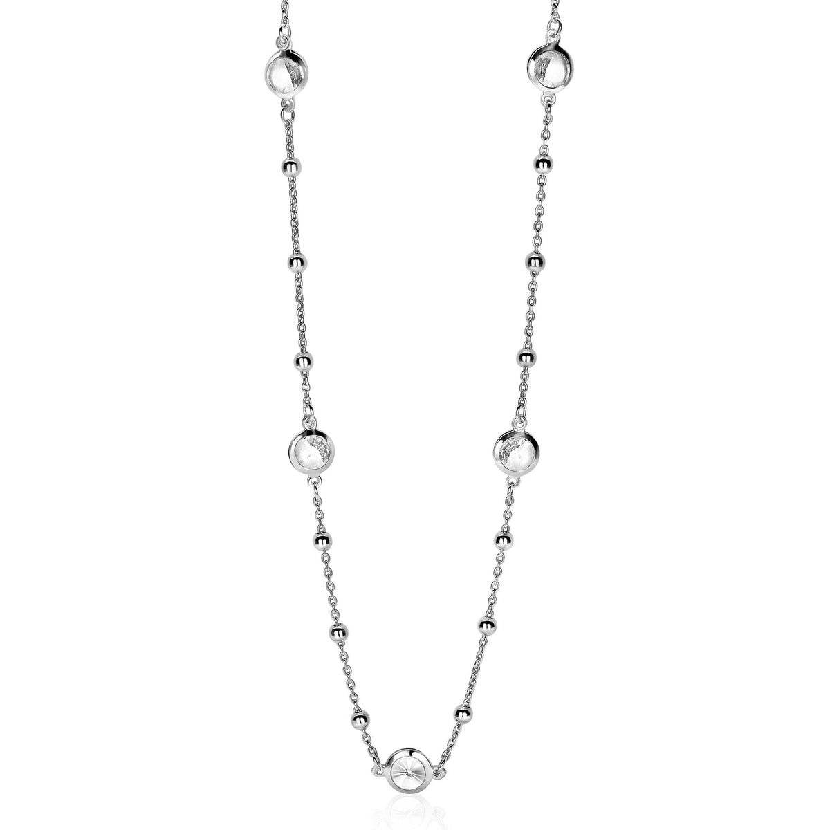 Zilveren ketting met ronde en bolvormige elementen, afgewerkt met kleine schakels.