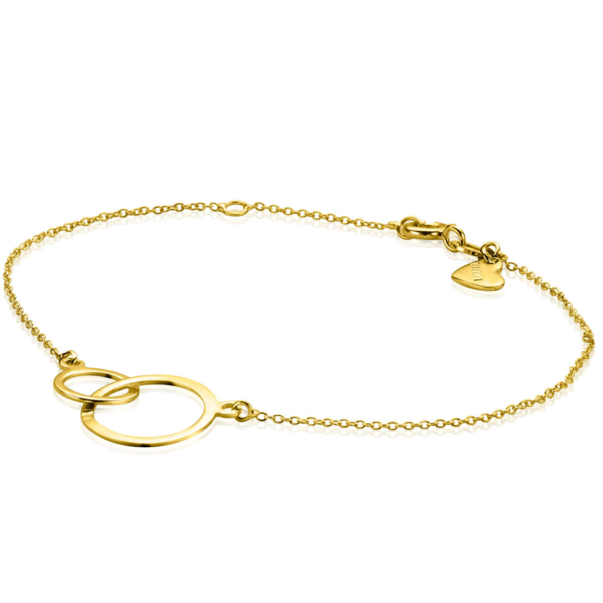 Gouden armband met twee overlappende ringen en een sluiting met hartvormig detail.