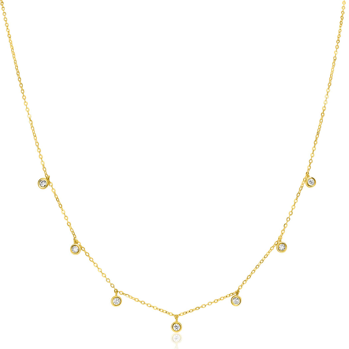 Gouden ketting met kleine cirkelvormige hangers en sprankelende steentjes.