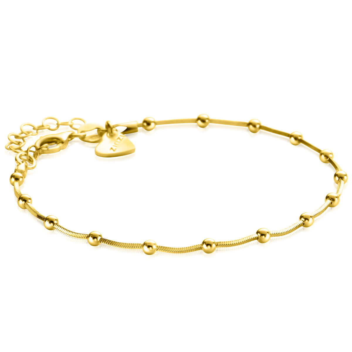 Gouden armband met bolletjes en een verlengketting, afgewerkt met een hartvormige sluiting.