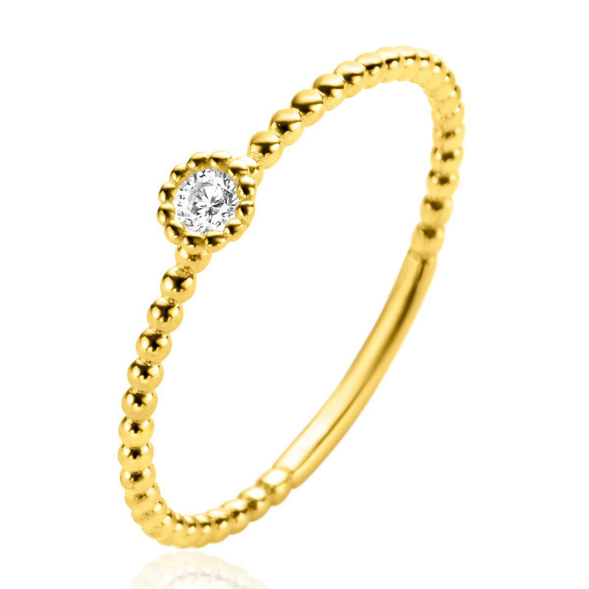Gouden ring met een bolletjesstructuur en een heldere, ronde zirkonia in het midden.